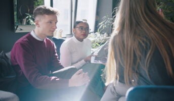 Two young people in a work discussion