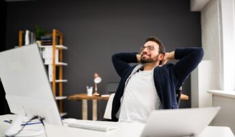 Man looking relaxed at his desk