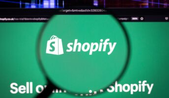 Shopify logo under magnifying glass