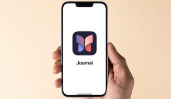 Apple iOS 17.2 Journal app on IPhone screen against a neutral background