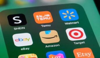 Online shopping app icons including Temu and Amazon on phone screen