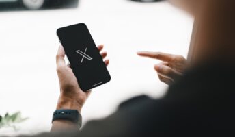 X logo on smart phone
