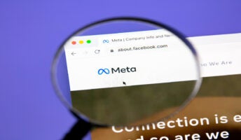 meta on webpage behind magnifying glass