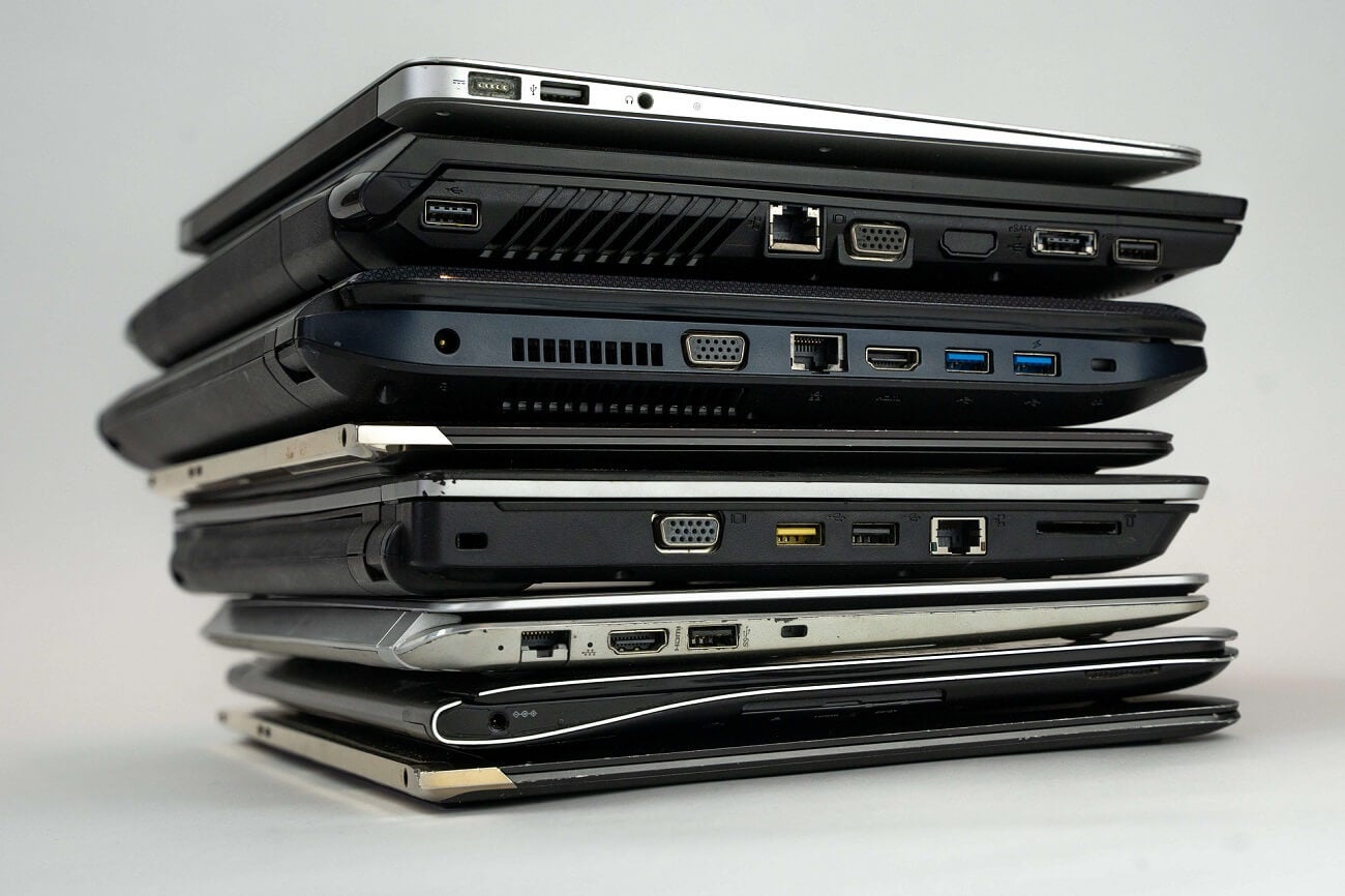 A stack of laptops, common IT assets